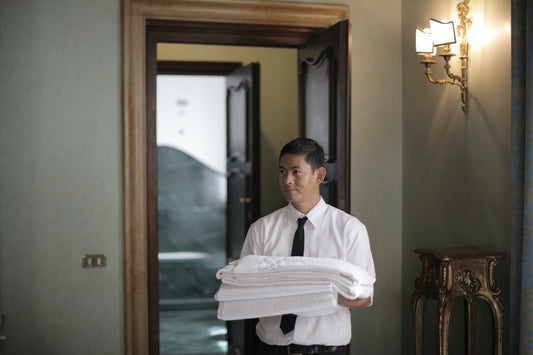 Guy in housekeeping uniform