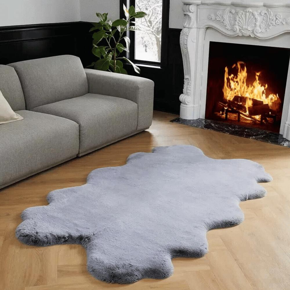 Sofa with floor mat and fireplace in a modern setting