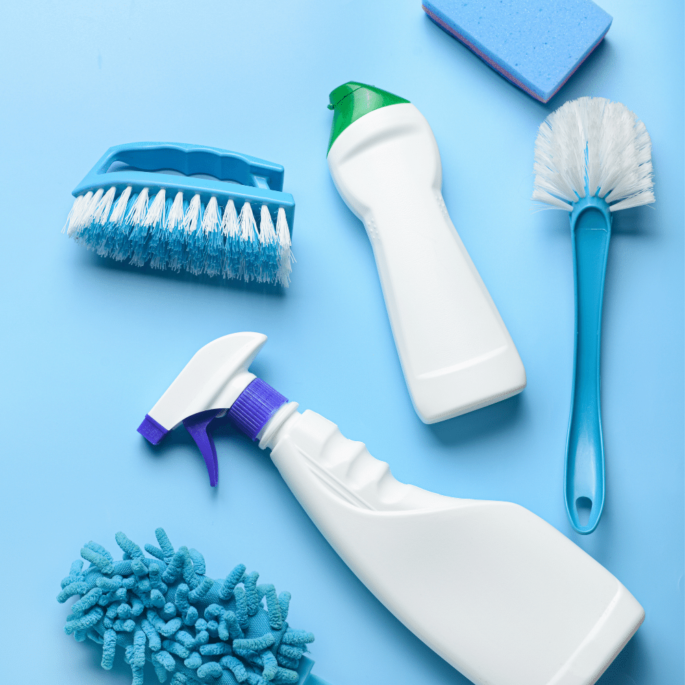 Assorted cleaning supplies including sponges, sprays, and brushes