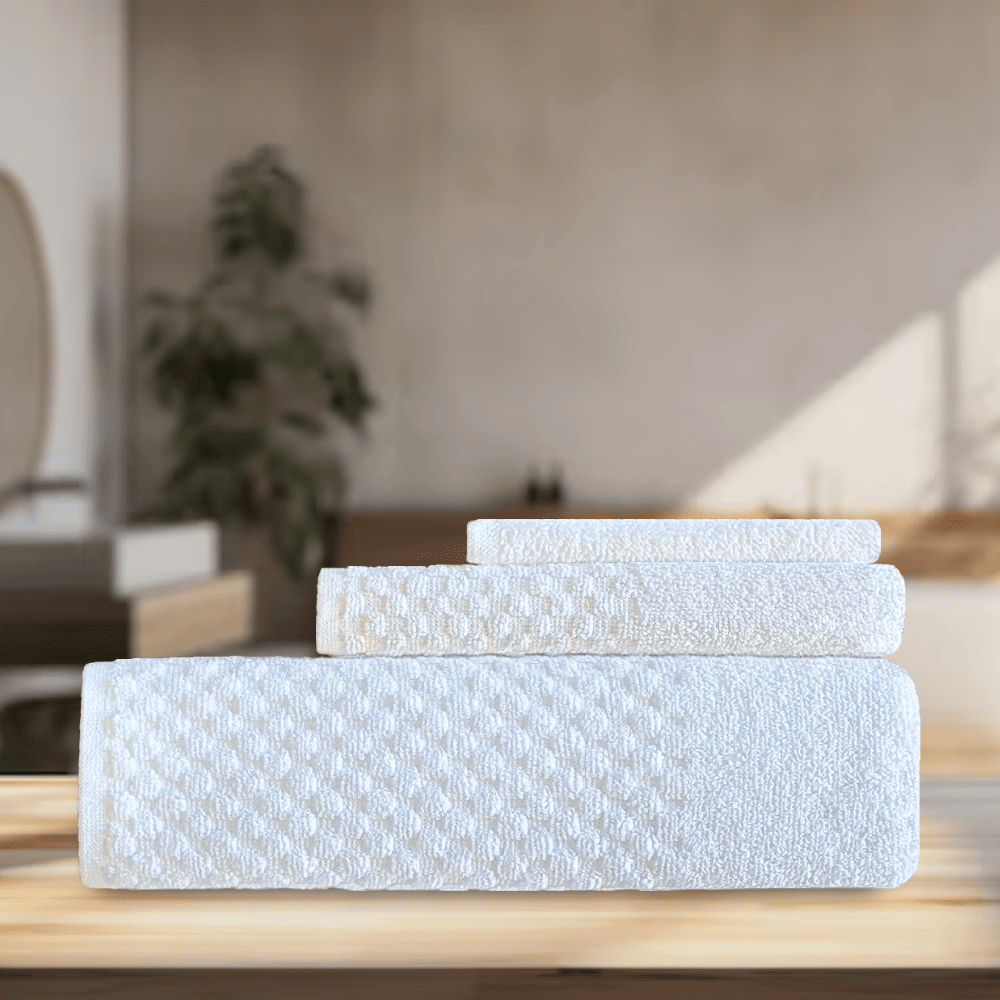 Soft, elegant hotel towels available in wholesale, designed to enhance the look of any washroom in Airbnb and hospitality settings. DT Series Towel Set - 3 Pc Background