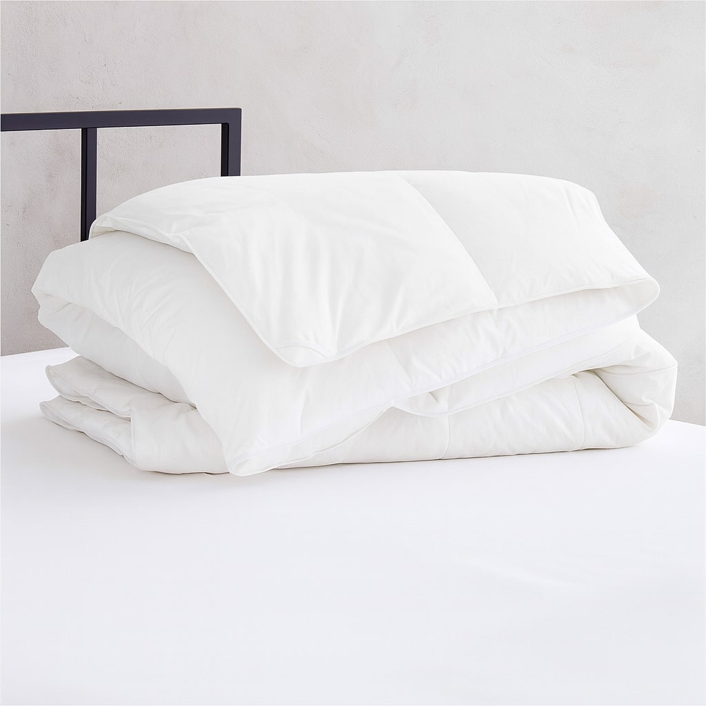 White lightweight duvet insert folded for display, ideal for hotels, inns, and rentals