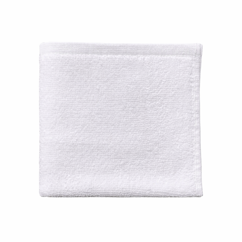 White cotton washcloth displayed flat, highlighting a smooth finish and a clean, spa-inspired look