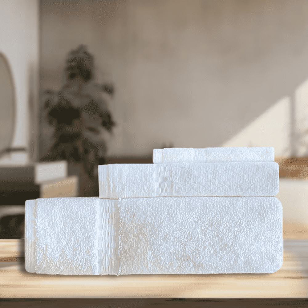 Wholesale premium hotel towels in various quantities, perfect for all washroom needs with a quick-dry design and superior quality. 3 towels on a Table view