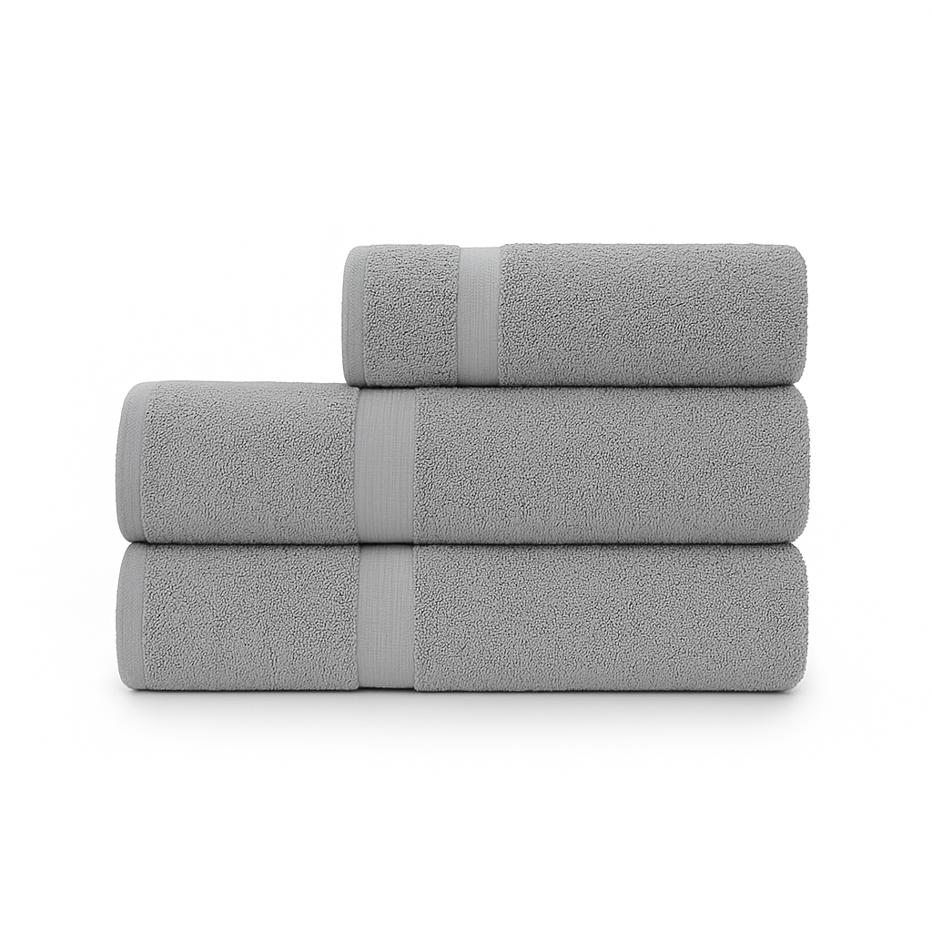 Affordable essential 3-piece grey towel set made from 100% combed cotton, soft and durable, perfect for hotels, spas, Airbnbs, or everyday home use