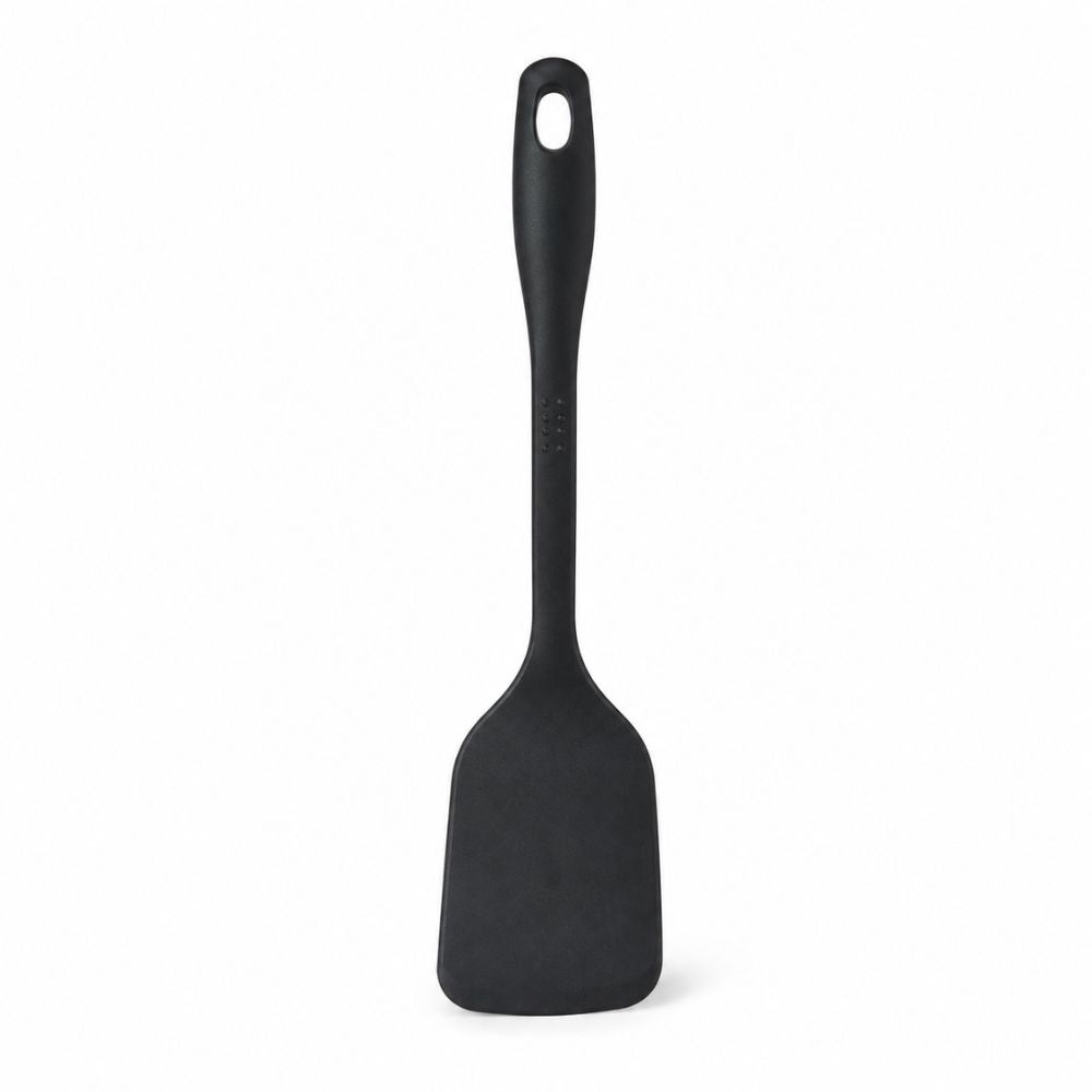 Black T-fal solid turner spatula with long handle for flipping, lifting and serving food while cooking at home.