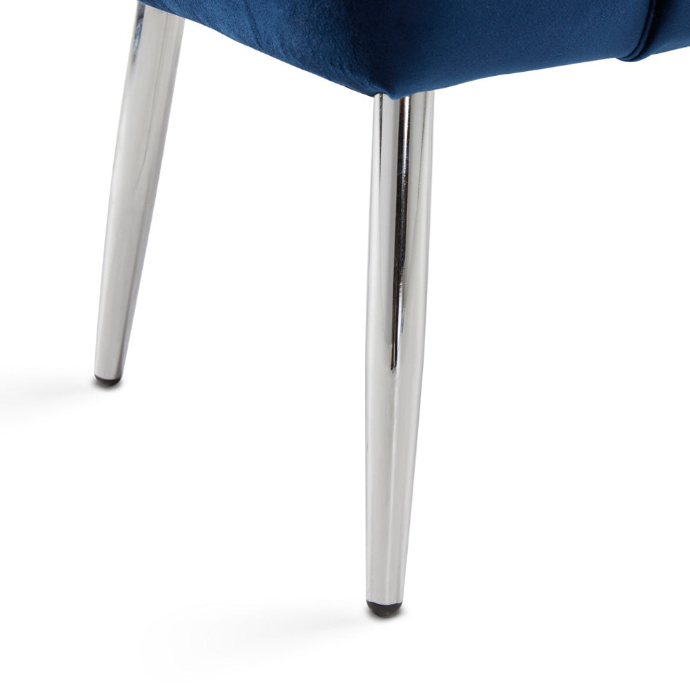 Close-up of the modern chrome leg, adding a touch of sophistication to the elegant blue velvet design