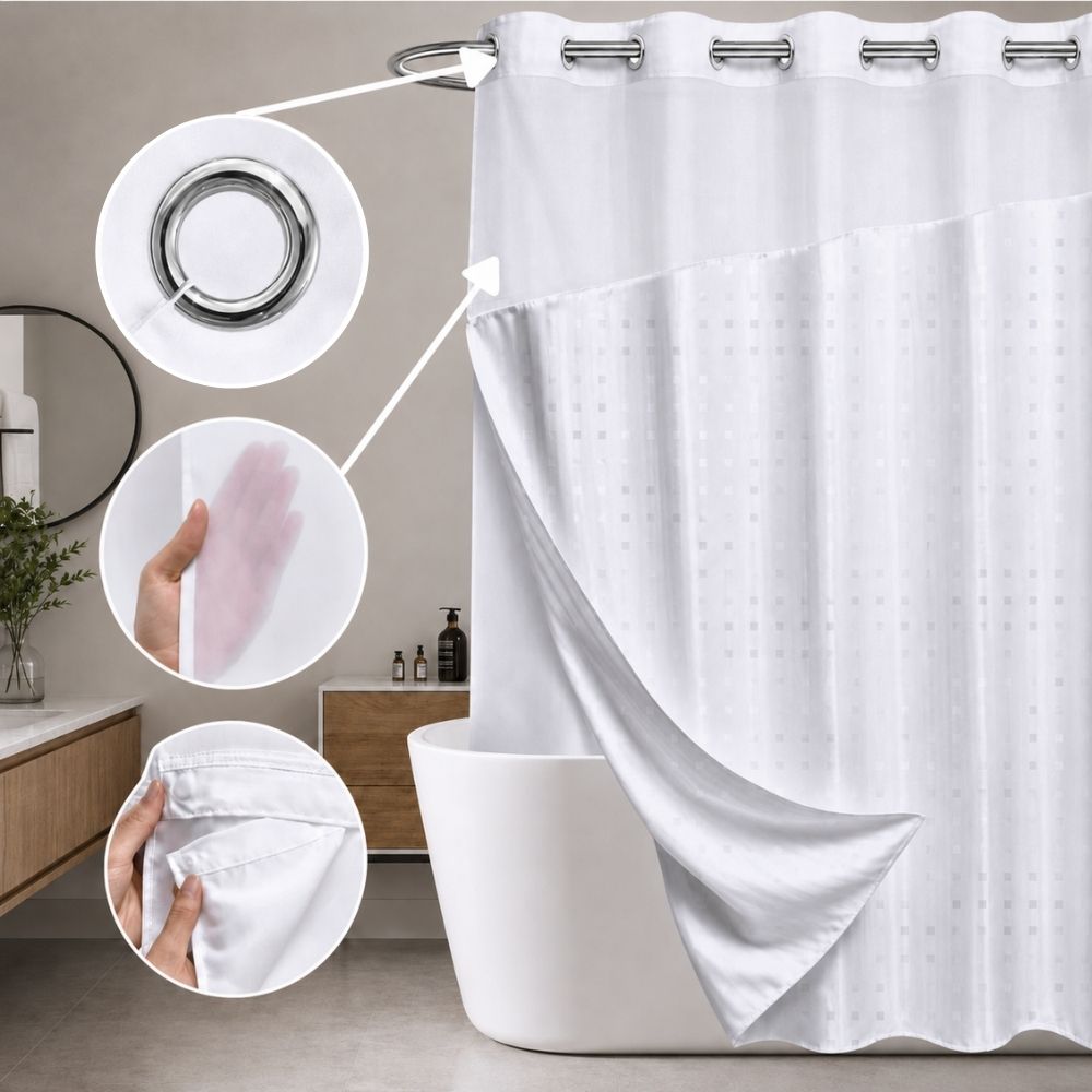 White patterned hookless shower curtain with sheer top panel, chrome grommets and detachable liner shown beside a bathtub.