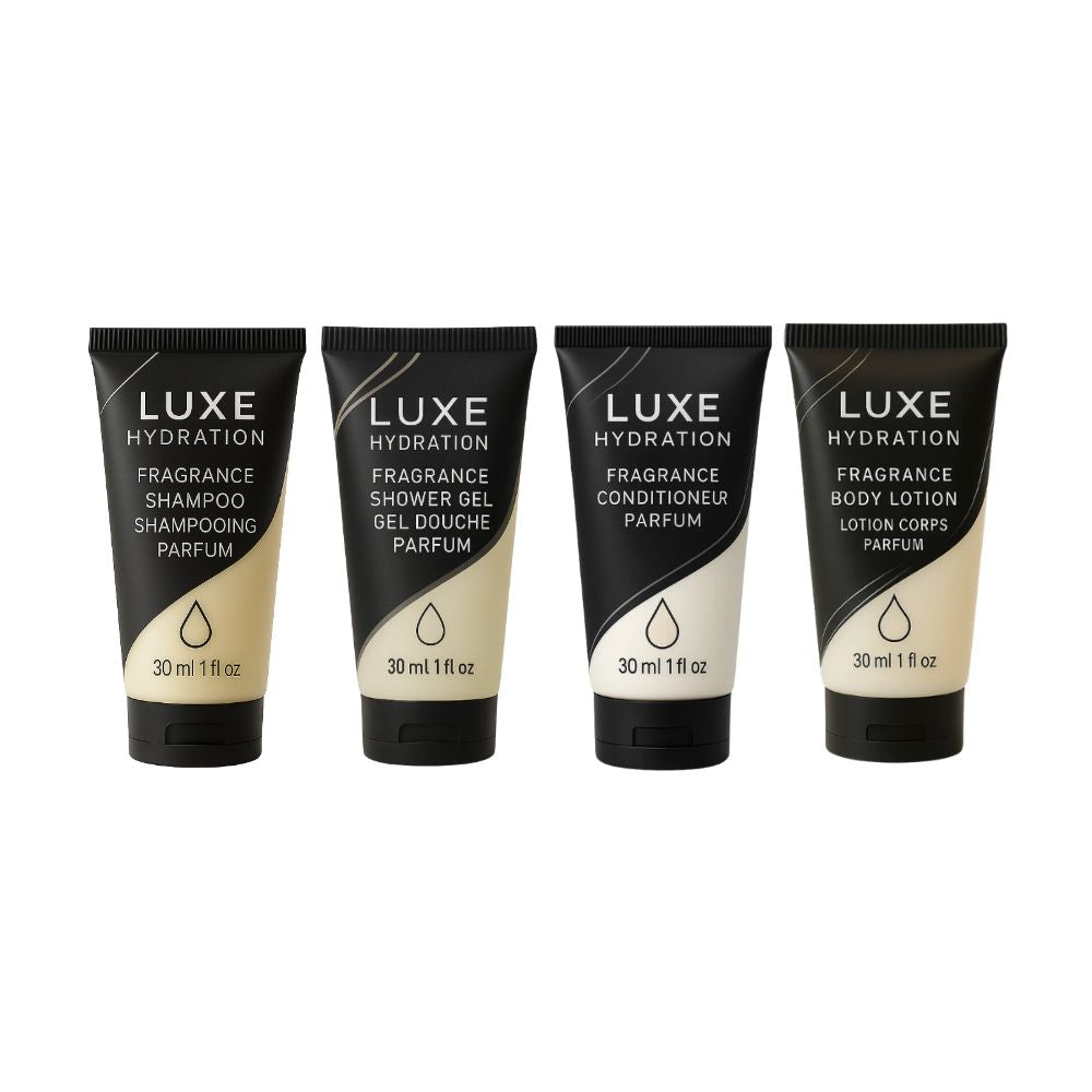 Luxe Hydration 4-piece fragrance travel toiletry set with 30ml shampoo, shower gel, conditioner and body lotion for personal care.