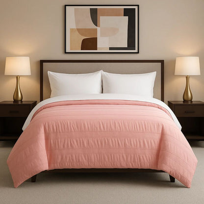 Pink moselle cotton duvet displayed in a bright neutral bedroom for a gentle, elegant and relaxing bedding look.