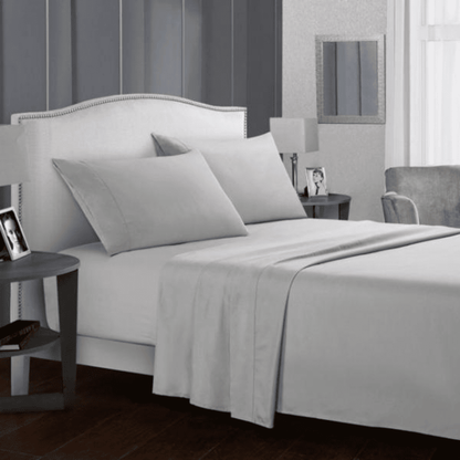 Luxury 5 star hotel Bed Sheet set on a modern upholstered bed in guest room.