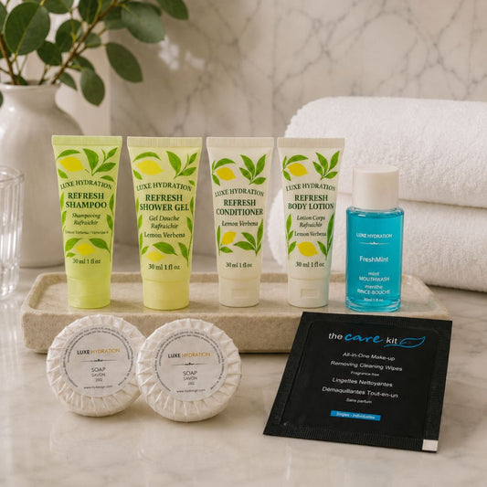 Lemon Verbena toiletries displayed in an elegant bathroom with two guest soaps, FreshMint mouthwash and makeup remover wipe.