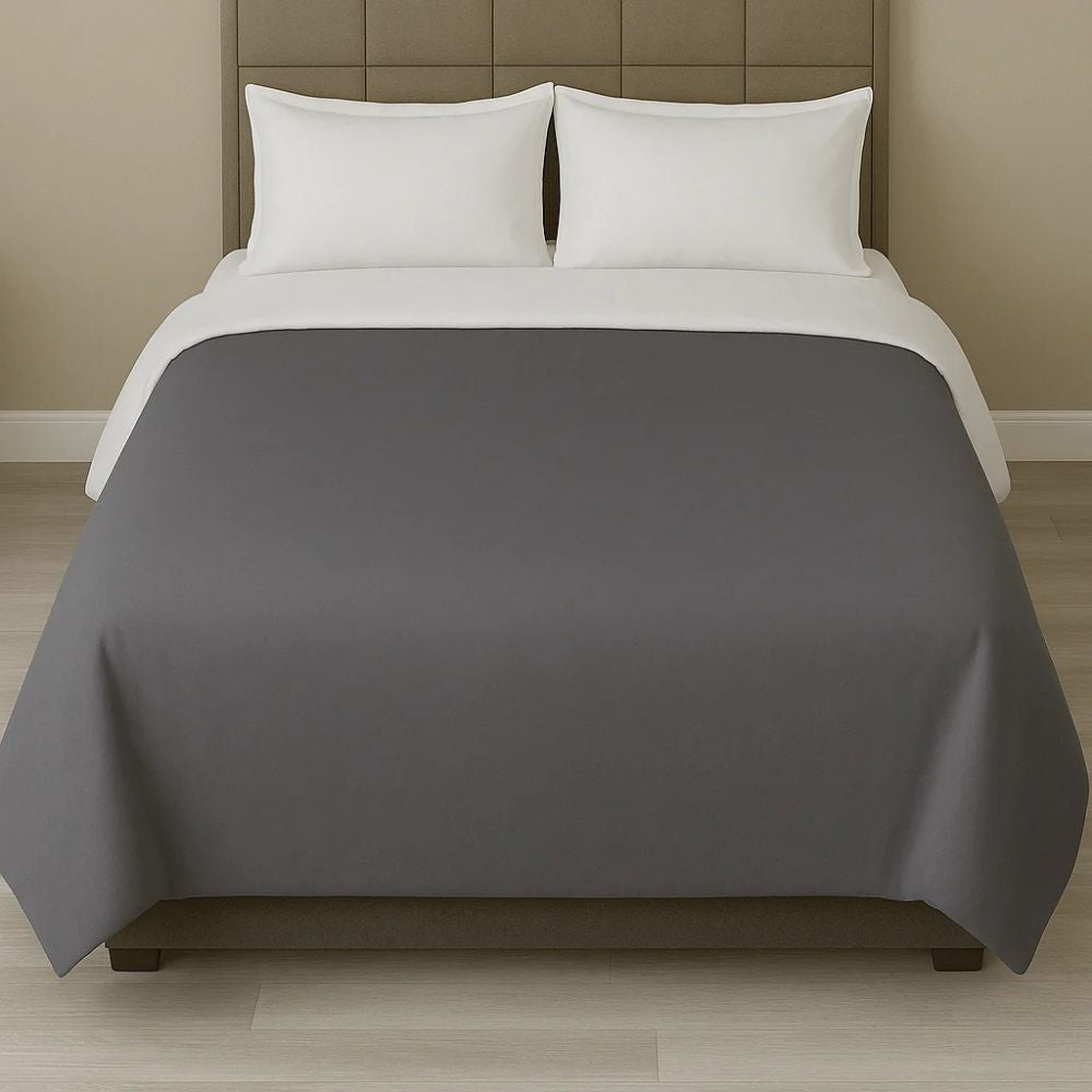 Dark grey duvet cover paired with white pillows for a sleek, modern and sophisticated bedroom style.