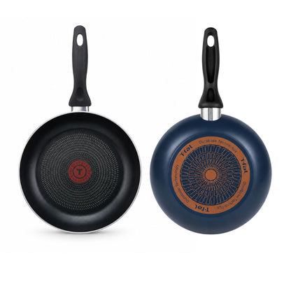 T-fal blue nonstick frying pan shown from the cooking surface and base, featuring a heat indicator and durable construction.
