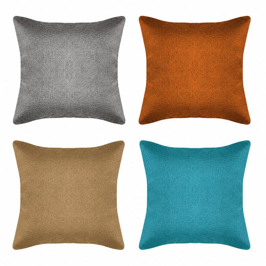Four square pillows in gray, orange, brown, and blue for hotels and motels 