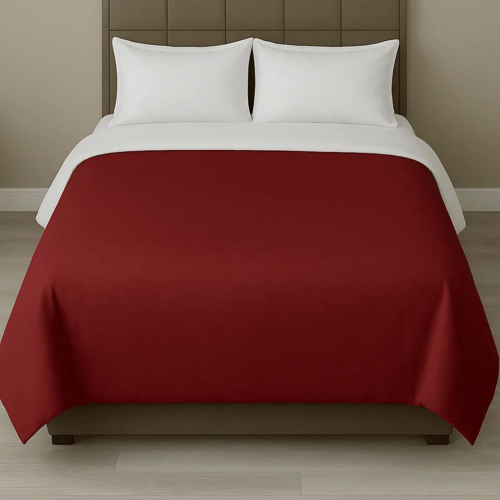 Deep red duvet cover paired with white pillows for a bold, rich and contemporary bedroom appearance.