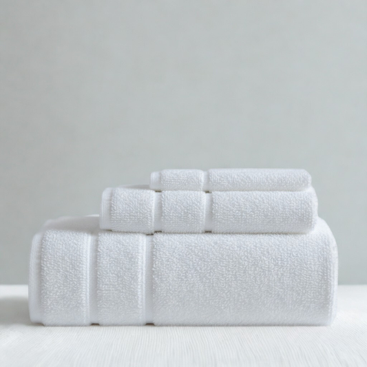 Premium absorbent cotton towel set with bath towels, hand towels, and washcloths in clean white.