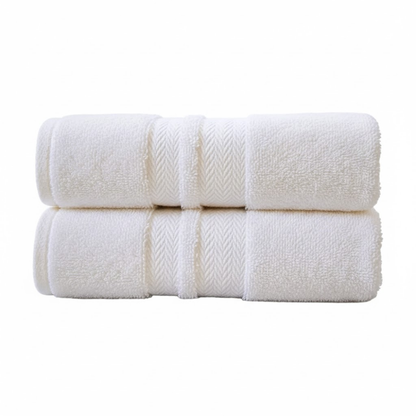 Folded cotton hand towel highlighting a dense weave, smooth finish, and refined, durable construction