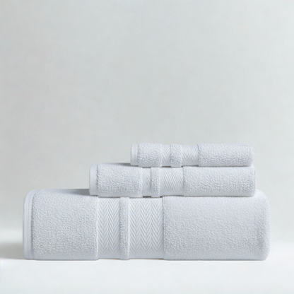 Plush cotton towels arranged neatly, showcasing exceptional softness and a clean, luxurious bathroom look