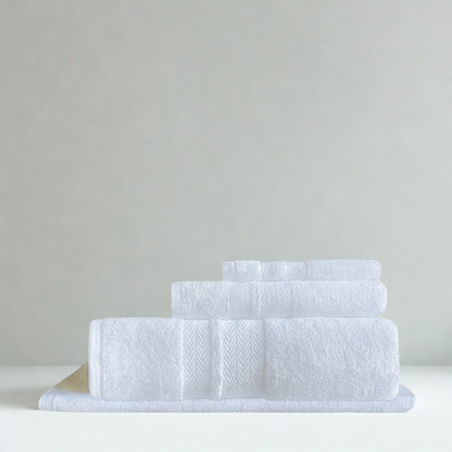 Folded cotton bath towels highlighting a thick, absorbent texture designed for everyday indulgence
