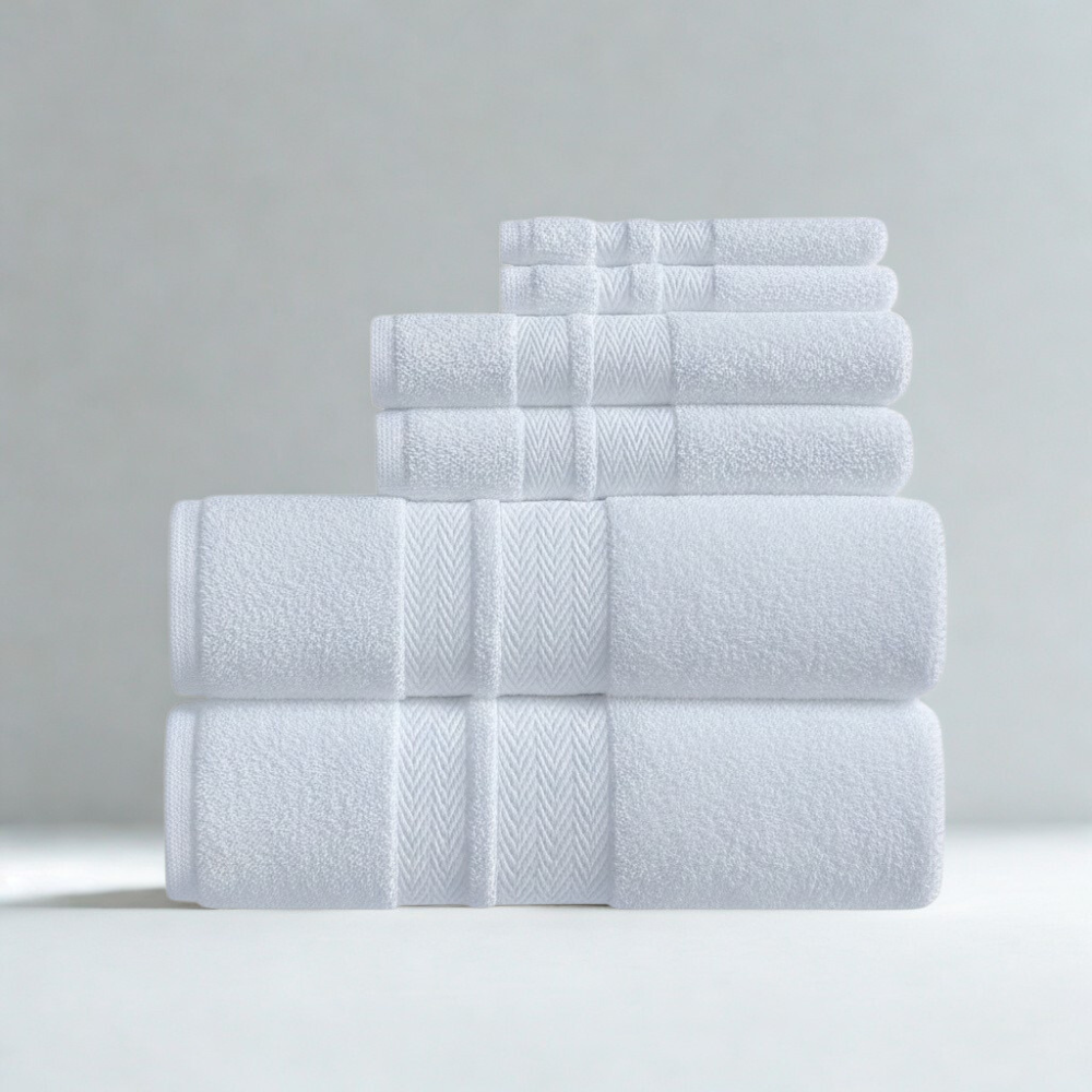 Close-up of premium cotton towel fabric revealing a soft, dense weave and a smooth hand feel