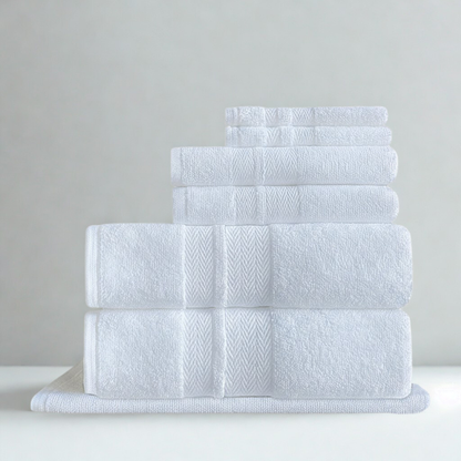 Coordinated cotton towel set displayed together for an elegant, polished bathroom presentation