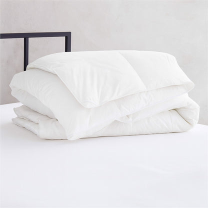 White lightweight duvet insert folded for display, ideal for hotels, inns, and rentals