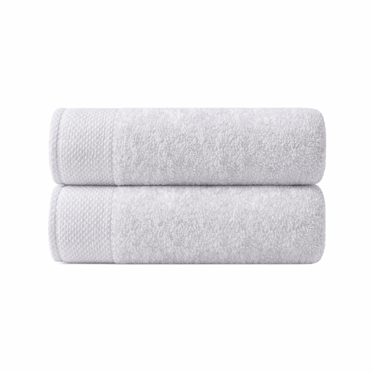 Cotton bath towels styled in a calm bathroom setting to reflect comfort, elegance, and everyday luxury