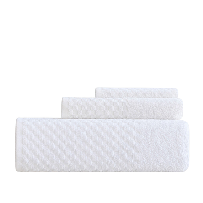 Premium cotton towels with a subtle square pattern, offering a soft, absorbent texture and a refined bathroom look