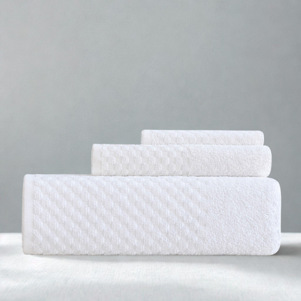 Folded cotton towels showcasing a square-patterned design and a plush feel for everyday comfort