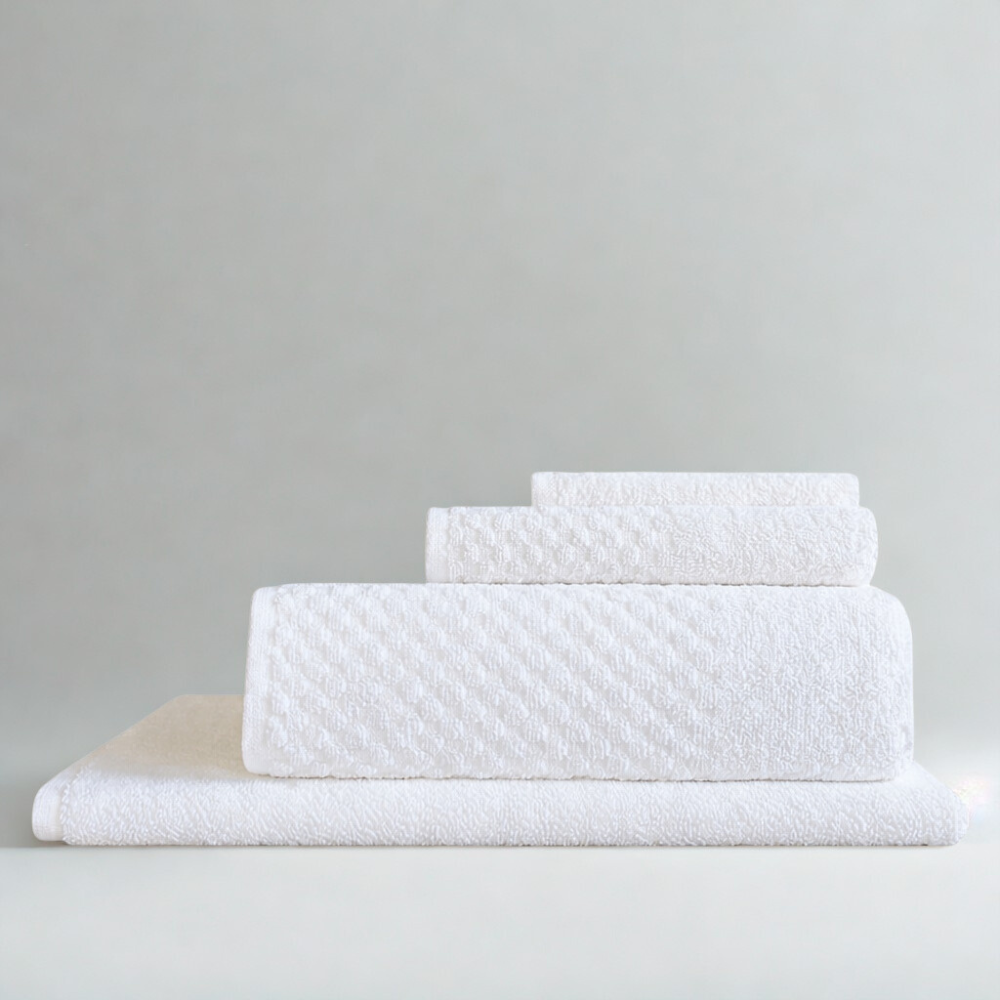 Close-up of cotton towel fabric highlighting the square pattern and its soft, absorbent weave