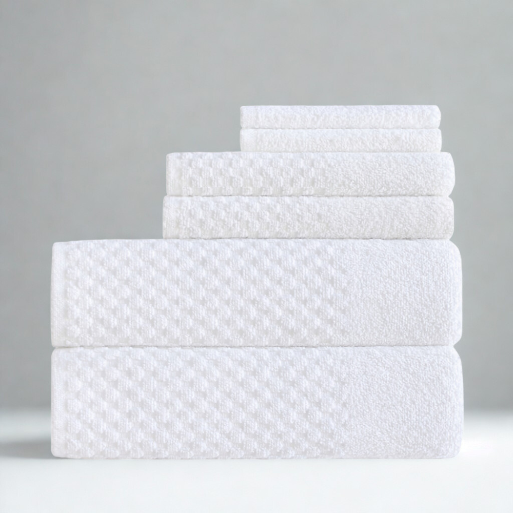 Coordinated cotton towel set arranged neatly, featuring a modern square texture and a clean, elegant style
