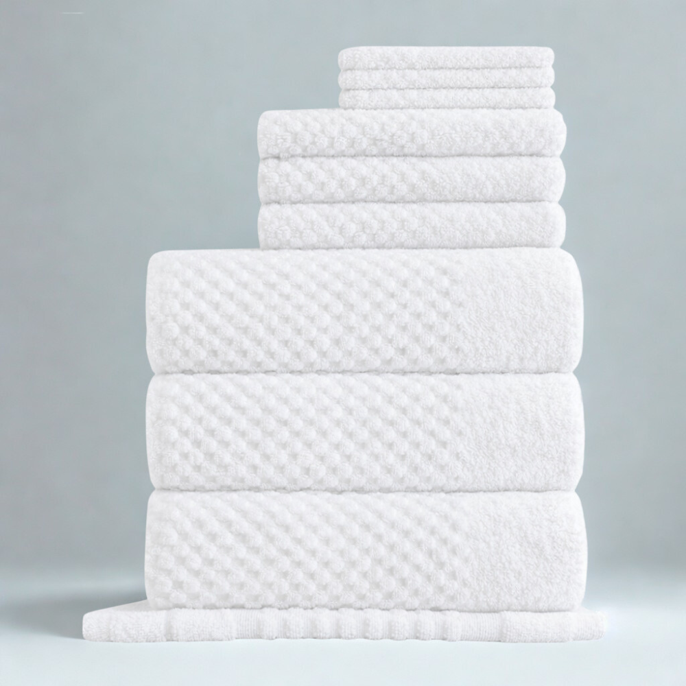 Cotton towels styled for a calm bathroom setting, combining softness, absorbency, and a modern textured design