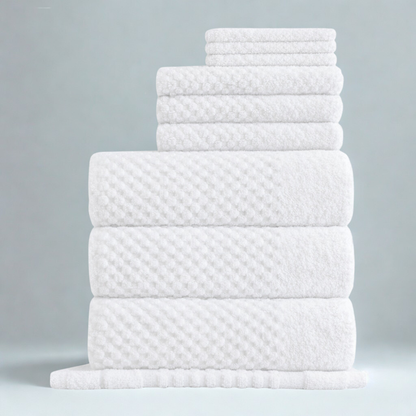 Cotton towels styled for a calm bathroom setting, combining softness, absorbency, and a modern textured design
