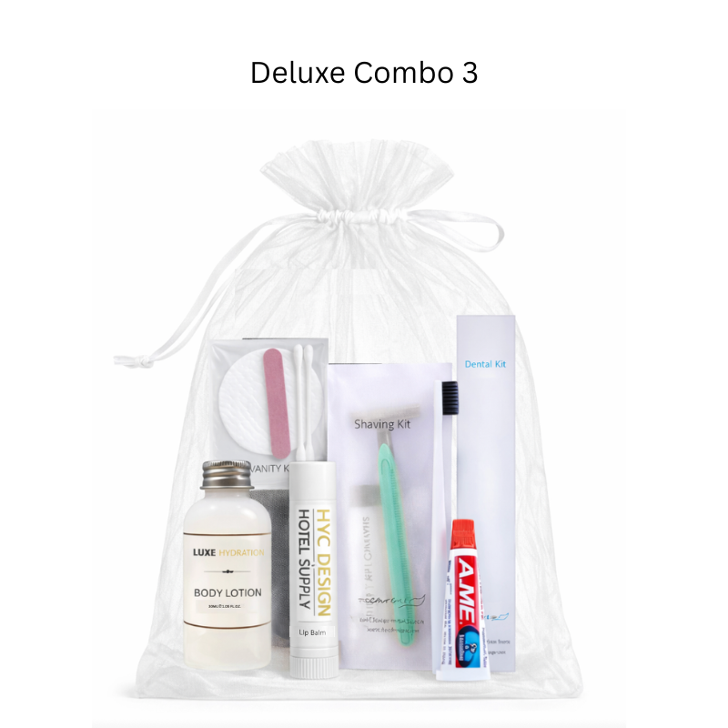Deluxe Combo 3 with toiletries including a bottle, brush, and toothpaste in a clear bag on a white background.