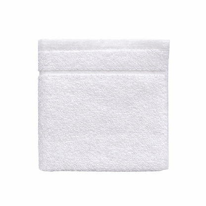 Close-up of a cotton washcloth showcasing double jacquard stripes and a smooth, absorbent woven texture