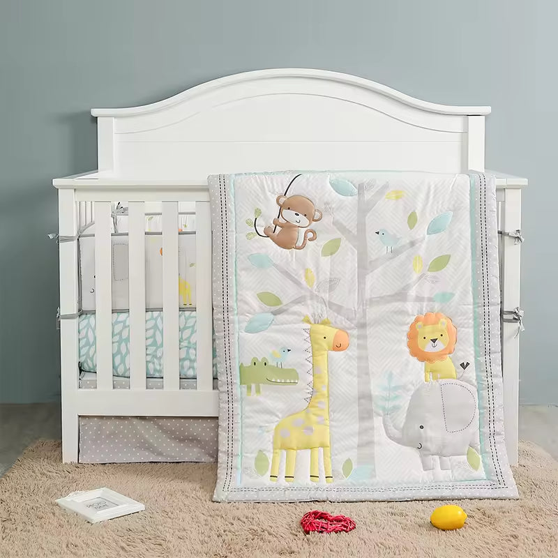 White crib with colorful animal-themed blanket.