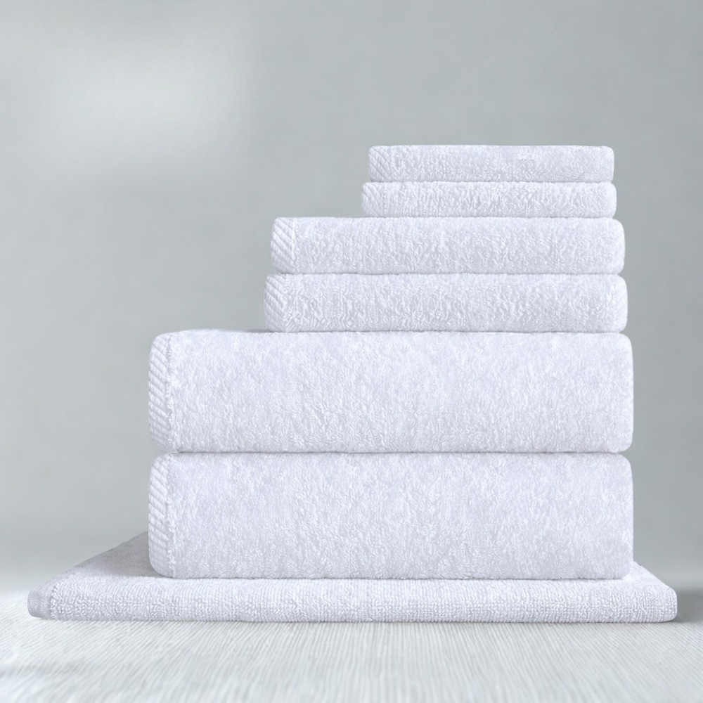 Soft cotton bath mat with a plush, non-slip surface, designed for a comfortable step out of the shower