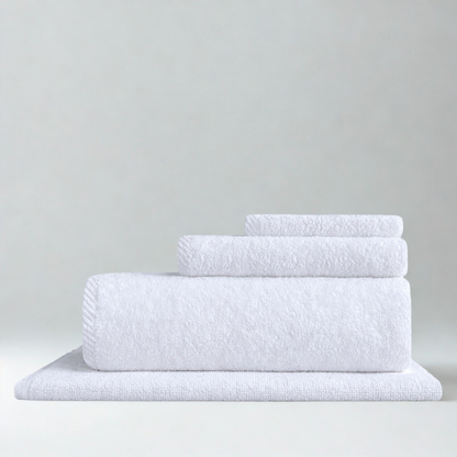 Coordinated cotton towel and bath mat set featuring a plush surface designed for comfort and everyday luxury