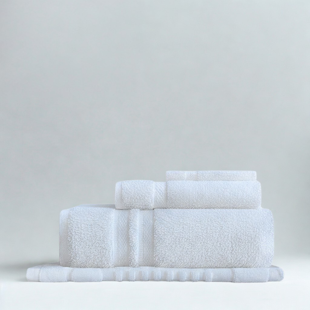 Cotton towel stack with a balanced, structured look that reflects durability and everyday luxury