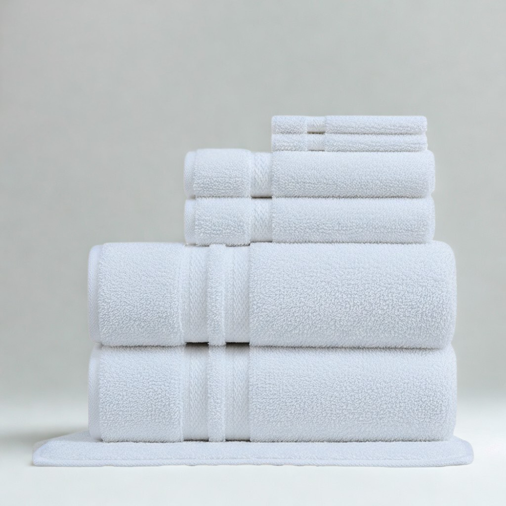 Plush cotton towel folded neatly to highlight its thickness, softness, and refined craftsmanship