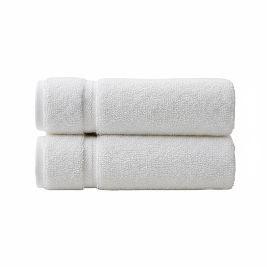 Plush white bath towels with a dobby border and subtle diamond pattern, designed for a luxurious, hotel-inspired feel