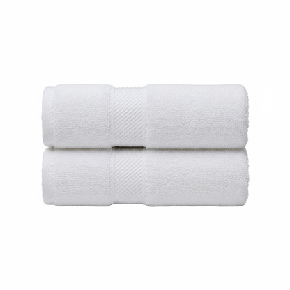 Plush white bath towels with a soft, absorbent texture and a refined single-side border for an elegant bathroom look