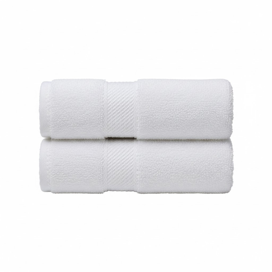 Plush white bath towels with a soft, absorbent texture and a refined single-side border for an elegant bathroom look