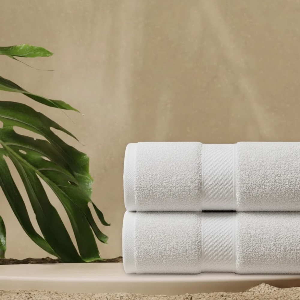 Folded combed cotton bath towels showcasing a thick, cozy feel and a clean, hotel-inspired presentation