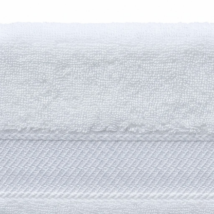 Close-up of bath towel fabric highlighting dense cotton loops and a smooth, luxurious finish