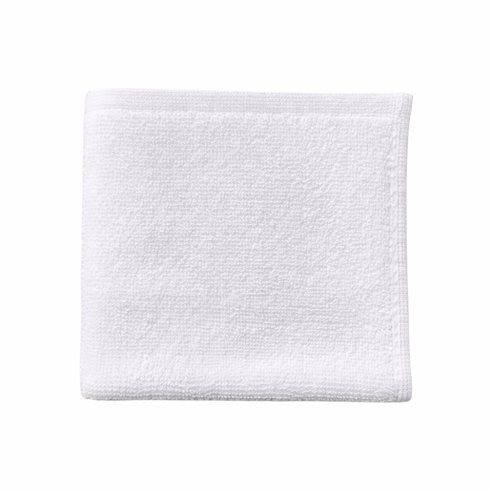 White cotton washcloth displayed flat, highlighting a clean finish and durable, easy-care design