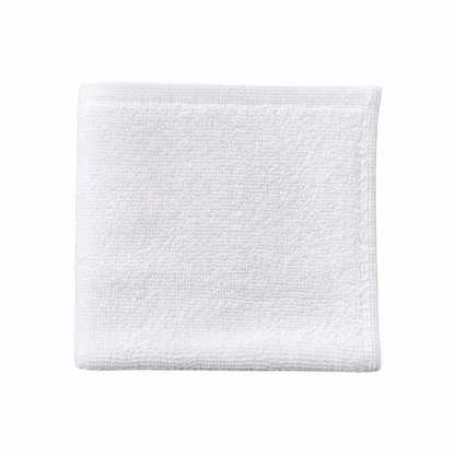 White cotton washcloth displayed flat, highlighting a clean finish and durable, easy-care design