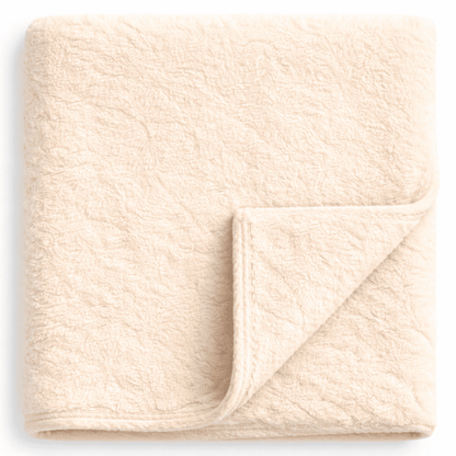 Plush ivory fleece blanket with clean border, ideal for hotel rooms, resorts and Airbnb spaces.