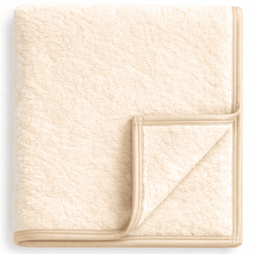 Premium ivory fleece blanket with piping, warm and inviting for hotel and Airbnb.