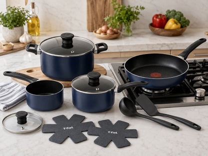 T-fal blue cookware set displayed in a modern kitchen with pots, frying pan, saucepan, lids, utensils and cookware protectors.